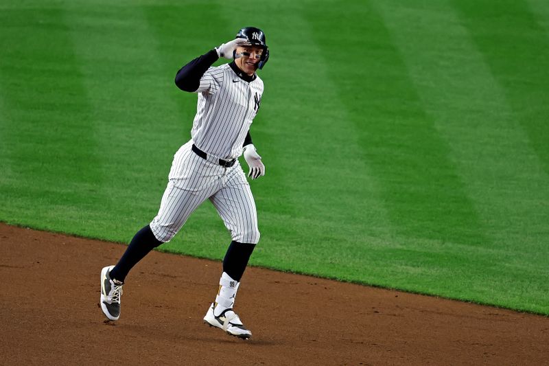 Oct 15, 2024; Bronx, New York, USA; New York Yankees outfielder Aaron Judge (99) runs the base after hitting a two run home run during the seventh inning against the Cleveland Guardians in game two of the ALCS for the 2024 MLB Playoffs at Yankee Stadium. Mandatory Credit: Brad Penner-Imagn Images