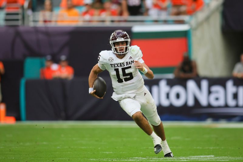 Sep 9, 2023; Miami Gardens, Florida, USA; Texas A&M Aggies quarterback Conner Weigman (15) runs with the football against the Miami Hurricanes during the second quarter at Hard Rock Stadium. Mandatory Credit: Sam Navarro-USA TODAY Sports