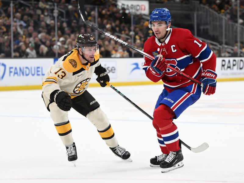 Jan 20, 2024; Boston, Massachusetts, USA; Montreal Canadiens center Nick Suzuki (14) skates against Boston Bruins center Charlie Coyle (13) during the second period at the TD Garden. Mandatory Credit: Brian Fluharty-USA TODAY Sports