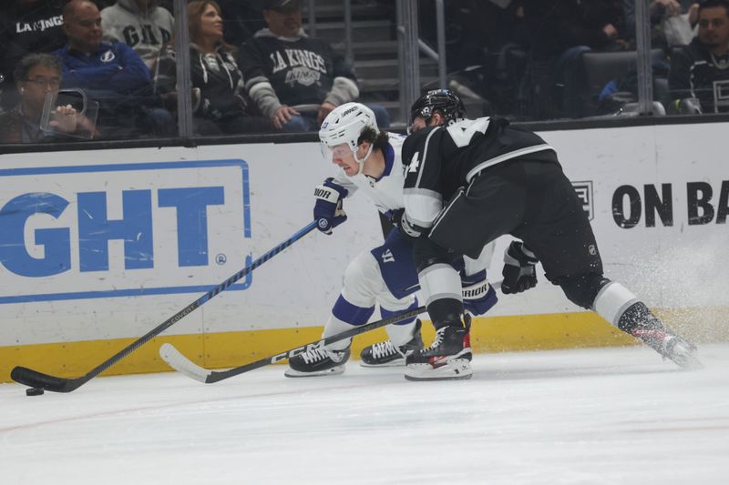 Mar 23, 2024; Los Angeles, California, USA; Tampa Bay Lighting center Michael Eyssimont (23) moves the puck as Los Angeles Kings defensemen Mikey Anderson (44) defends during the first period of an NHL hockey game at Crypto.com Arena. Mandatory Credit: Yannick Peterhans-USA TODAY Sports