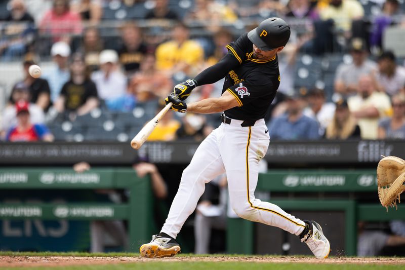 May 5, 2024; Pittsburgh, Pennsylvania, USA; Pittsburgh Pirates left fielder Bryan Reynolds (10) hits a triple during the seventh inning against the Colorado Rockies at PNC Park. Mandatory Credit: Scott Galvin-USA TODAY Sports