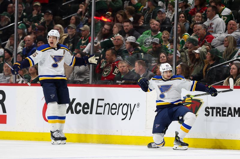 Mar 23, 2024; Saint Paul, Minnesota, USA; St. Louis Blues center Jordan Kyrou (25) celebrates his hat-trick against the Minnesota Wild during the third period at Xcel Energy Center. Mandatory Credit: Matt Krohn-USA TODAY Sports