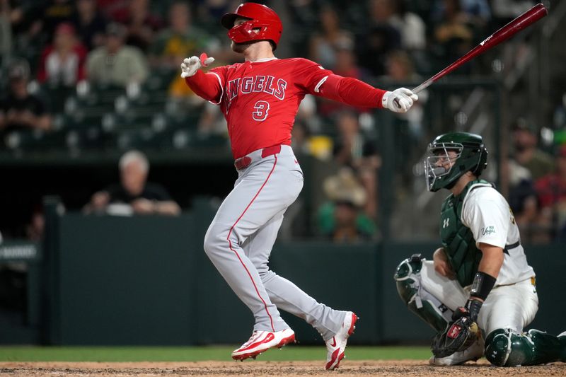 May 21, 2025; West Sacramento, California, USA; Los Angeles Angels left fielder Taylor Ward (3) hits a triple against the Athletics in the eighth inning at Sutter Health Park. Mandatory Credit: Cary Edmondson-Imagn Images