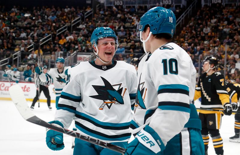 Mar 14, 2024; Pittsburgh, Pennsylvania, USA; San Jose Sharks left wing Fabian Zetterlund (left) and center Klim Kostin (10) react after a goal by Kostin against the Pittsburgh Penguins during the second period at PPG Paints Arena. Mandatory Credit: Charles LeClaire-USA TODAY Sports