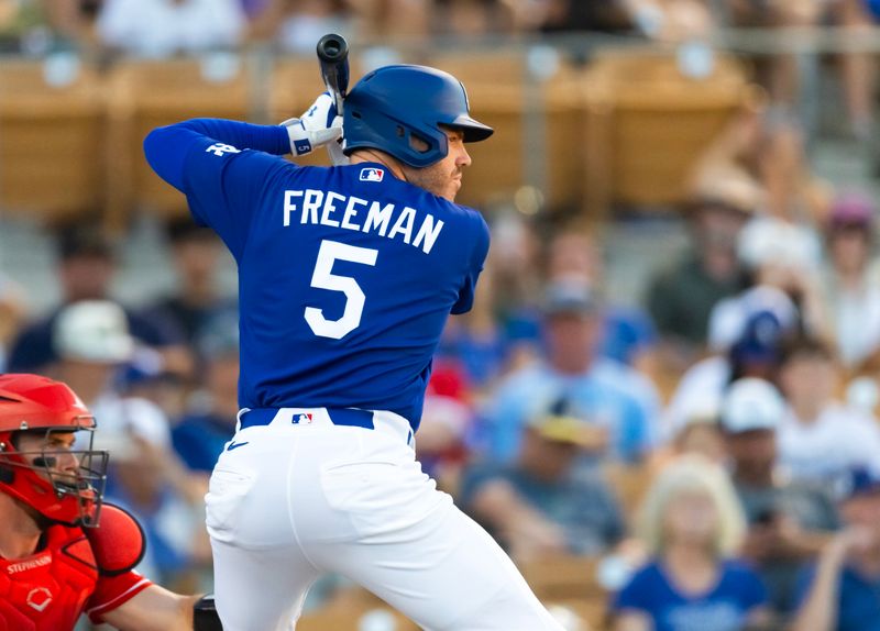 Mar 12, 2026; Phoenix, Arizona, USA; Los Angeles Dodgers first baseman Freddie Freeman against the Cincinnati Reds during a spring training game at Camelback Ranch-Glendale. Mandatory Credit: Mark J. Rebilas-Imagn Images
