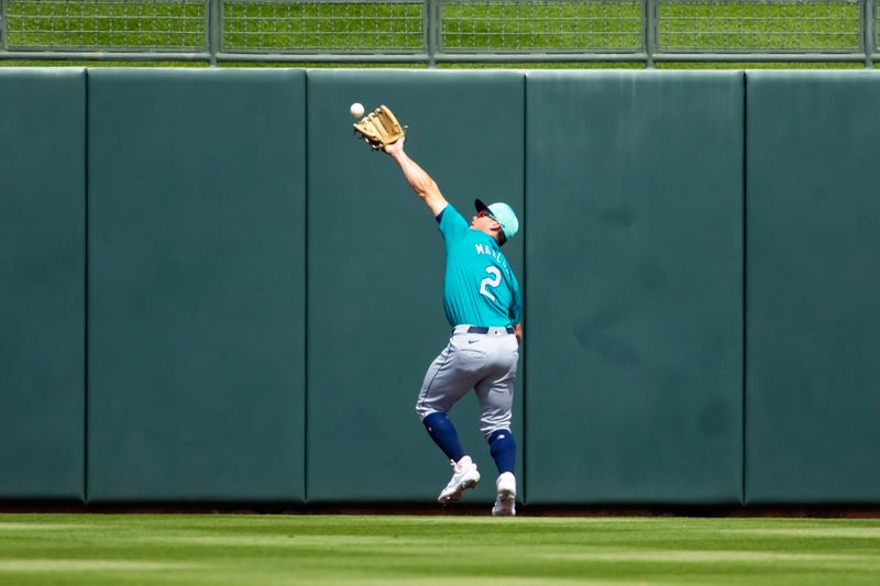 Mar 18, 2024; Surprise, Arizona, USA; Seattle Mariners outfielder Cade Marlowe catches a deep fly ball against the Texas Rangers during a spring training baseball game at Surprise Stadium. Mandatory Credit: Mark J. Rebilas-USA TODAY Sports