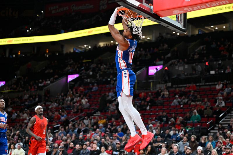 PORTLAND, OREGON - JANUARY 29: Ricky Council IV #16 of the Philadelphia 76ers does a 360-degree dunk during the fourth quarter against the Portland Trail Blazers at the Moda Center on January 29, 2024 in Portland, Oregon. The Portland Trail Blazers won 130-104. NOTE TO USER: User expressly acknowledges and agrees that, by downloading and or using this photograph, User is consenting to the terms and conditions of the Getty Images License Agreement. (Photo by Alika Jenner/Getty Images)