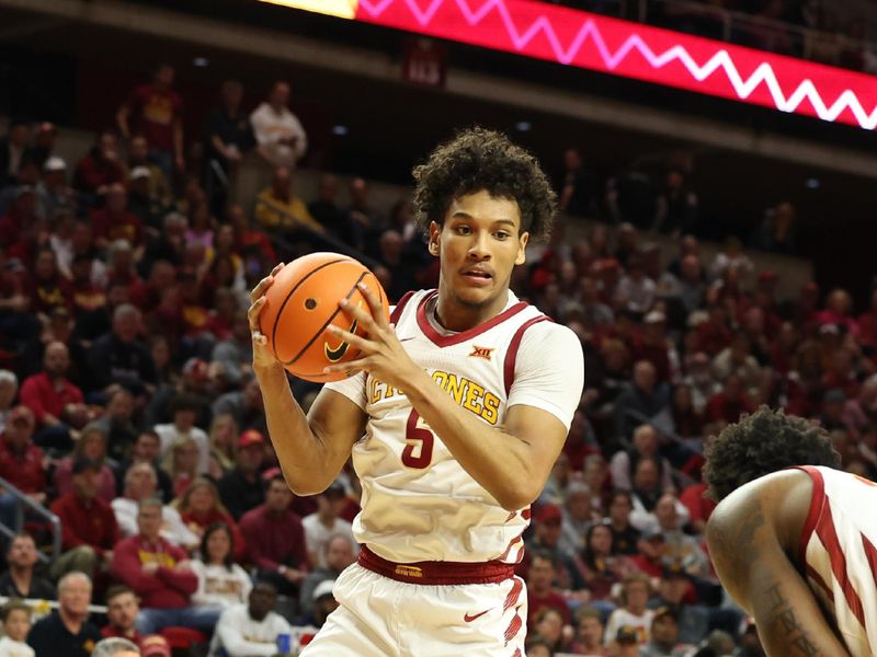 Feb 24, 2024; Ames, Iowa, USA; Iowa State Cyclones guard Curtis Jones (5) grabs a rebound in their game against the West Virginia Mountaineers during the second half at James H. Hilton Coliseum. Mandatory Credit: Reese Strickland-USA TODAY Sports