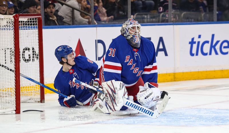 Jan 18, 2025; New York, New York, USA; New York Rangers center Adam Edstrom (84) collides with New York Rangers goalie Igor Shesterkin (31) behind the net during the second period against the Columbus Blue Jackets at Madison Square Garden. Mandatory Credit: Danny Wild-Imagn Images