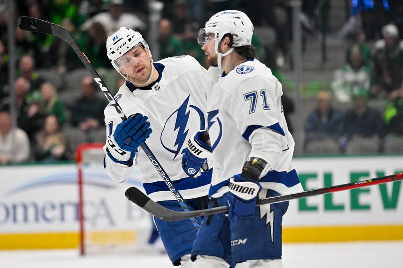 Feb 11, 2023; Dallas, Texas, USA; Tampa Bay Lightning defenseman Erik Cernak (81) and center Anthony Cirelli (71) celebrate the win over the Dallas Stars at the American Airlines Center. Mandatory Credit: Jerome Miron-USA TODAY Sports