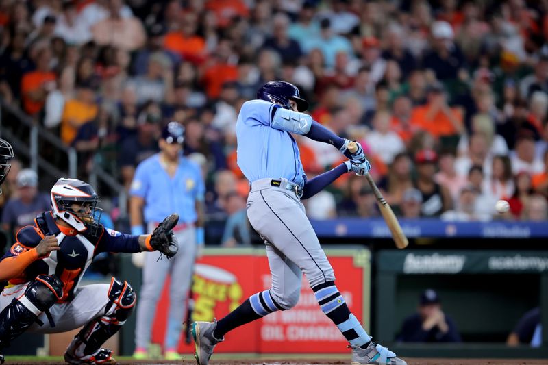 Jul 30, 2023; Houston, Texas, USA; Tampa Bay Rays right fielder Josh Lowe (15) hits an RBI double against the Houston Astros during the first inning at Minute Maid Park. Mandatory Credit: Erik Williams-USA TODAY Sports