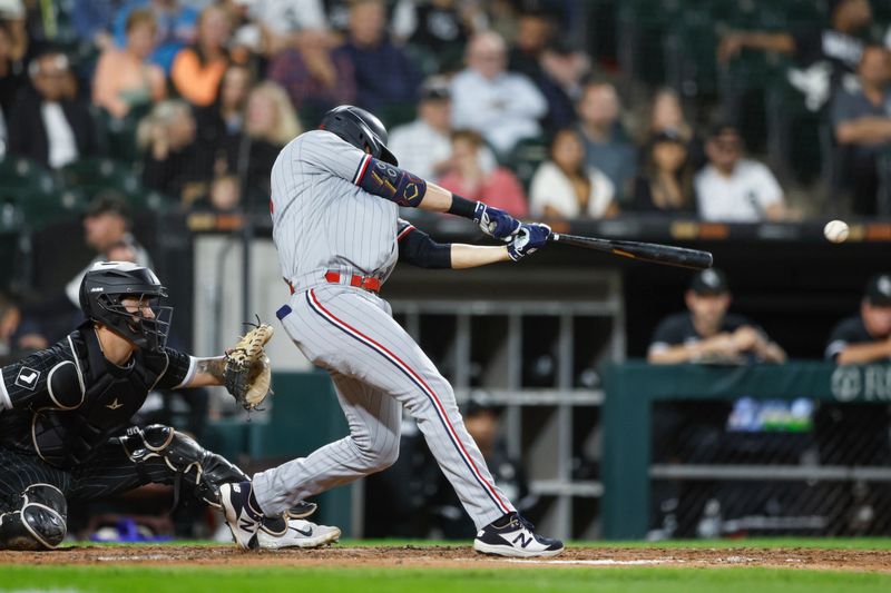 Sep 15, 2023; Chicago, Illinois, USA; Minnesota Twins first baseman Alex Kirilloff (19) singles against the Chicago White Sox during the fourth inning at Guaranteed Rate Field. Mandatory Credit: Kamil Krzaczynski-USA TODAY Sports