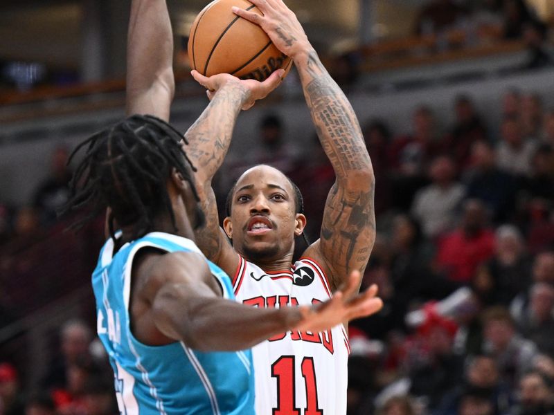 CHICAGO, ILLINOIS - JANUARY 05: DeMar DeRozan #11 of the Chicago Bulls shoots for two points over Nathan Mensah #31 of the Charlotte Hornets in the first half on January 05, 2024 at United Center in Chicago, Illinois.  NOTE TO USER: User expressly acknowledges and agrees that, by downloading and or using this photograph, User is consenting to the terms and conditions of the Getty Images License Agreement. (Photo by Jamie Sabau/Getty Images)