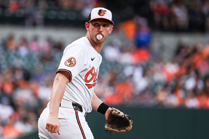 Jul 11, 2024; Baltimore, Maryland, USA; Baltimore Orioles third baseman Jordan Westburg (11) blows a bubble while returning to third base after aChicago Cubs third inning foul ball at Oriole Park at Camden Yards. Mandatory Credit: Tommy Gilligan-USA TODAY Sports