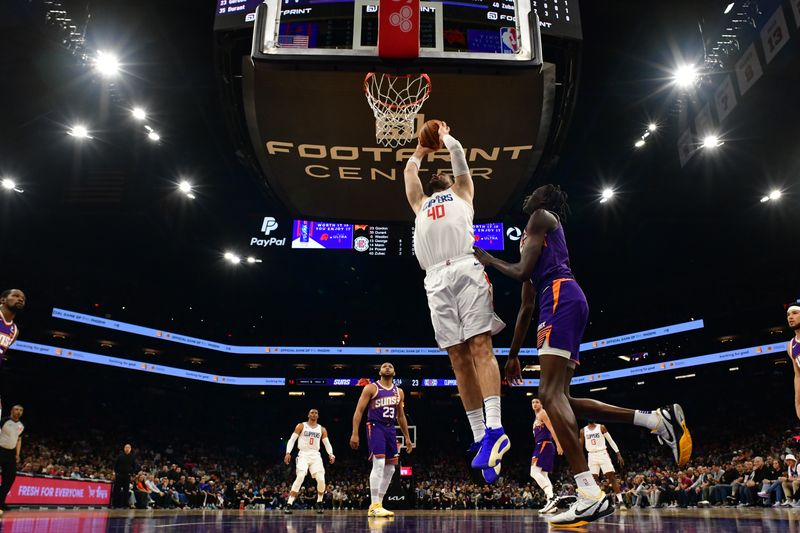 PHOENIX, AZ - APRIL  9:  Ivica Zubac #40 of the LA Clippers drives to the basket during the game against the Phoenix Suns on April 9, 2024 at Footprint Center in Phoenix, Arizona. NOTE TO USER: User expressly acknowledges and agrees that, by downloading and or using this photograph, user is consenting to the terms and conditions of the Getty Images License Agreement. Mandatory Copyright Notice: Copyright 2024 NBAE (Photo by Kate Frese/NBAE via Getty Images)