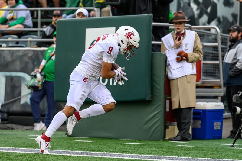 Oct 21, 2023; Eugene, Oregon, USA; Washington State Cougars wide receiver Isaiah Hamilton (9) catches a pass for a touchdown in the 4th quarter against the Oregon Ducks at Autzen Stadium. Mandatory Credit: Craig Strobeck-USA TODAY Sports