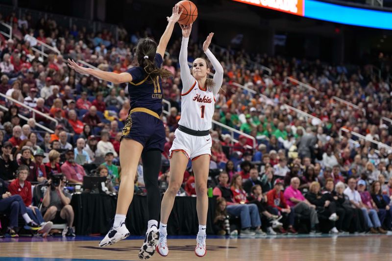 Mar 9, 2024; Greensboro, NC, USA; Notre Dame Fighting Irish guard Sonia Citron (11) blocks the attempted shot of Virginia Tech Hokies guard Carleigh Wenzel (1) in the first half at Greensboro Coliseum. Mandatory Credit: David Yeazell-USA TODAY Sports