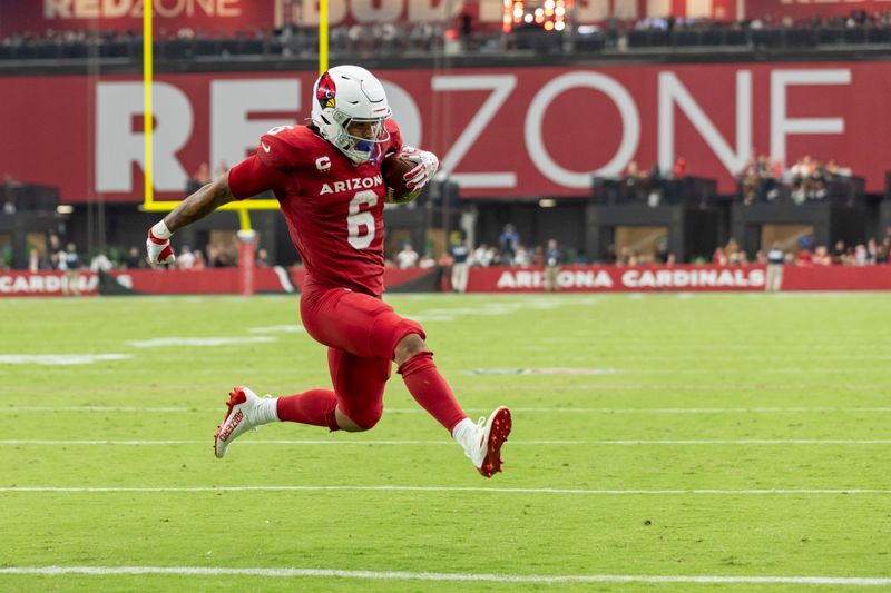 Arizona Cardinals running back James Conner (6) runs the ball and scores a touchdown against the Los Angeles Rams in an NFL football game, Sunday, Sept. 15, 2024, in Glendale, Ariz. Cardinals defeated the Rams 41-10. (AP Photo/Jeff Lewis)