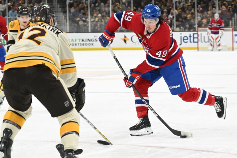 Jan 20, 2024; Boston, Massachusetts, USA; Montreal Canadiens left wing Rafael Harvey-Pinard (49) shoots the puck against the Boston Bruins during the second period at the TD Garden. Mandatory Credit: Brian Fluharty-USA TODAY Sports