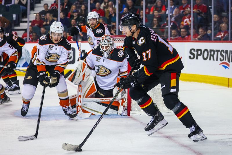 Apr 2, 2024; Calgary, Alberta, CAN; Calgary Flames center Yegor Sharangovich (17) controls the puck against the Anaheim Ducks during the third period at Scotiabank Saddledome. Mandatory Credit: Sergei Belski-USA TODAY Sports