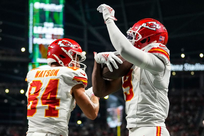 Kansas City Chiefs wide receiver JuJu Smith-Schuster (9) celebrates his touchdown with Justin Watson (84) during the second half of an NFL football game against the Atlanta Falcons, Sunday, Sept. 22, 2024, in Atlanta. (AP Photo/Brynn Anderson)