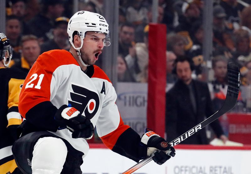 Feb 25, 2024; Pittsburgh, Pennsylvania, USA;  Philadelphia Flyers center Scott Laughton (21) reacts after scoring a goal against the Pittsburgh Penguins during the first period at PPG Paints Arena. Mandatory Credit: Charles LeClaire-USA TODAY Sports