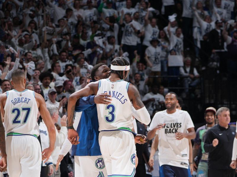 MINNEAPOLIS, MN -  APRIL 23: The Minnesota Timberwolves celebrate a play by Jaden McDaniels #3 during the game against the Phoenix Suns during Round One Game Two of the 2024 NBA Playoffs on April 23, 2024 at Target Center in Minneapolis, Minnesota. NOTE TO USER: User expressly acknowledges and agrees that, by downloading and or using this Photograph, user is consenting to the terms and conditions of the Getty Images License Agreement. Mandatory Copyright Notice: Copyright 2024 NBAE (Photo by Jordan Johnson/NBAE via Getty Images)