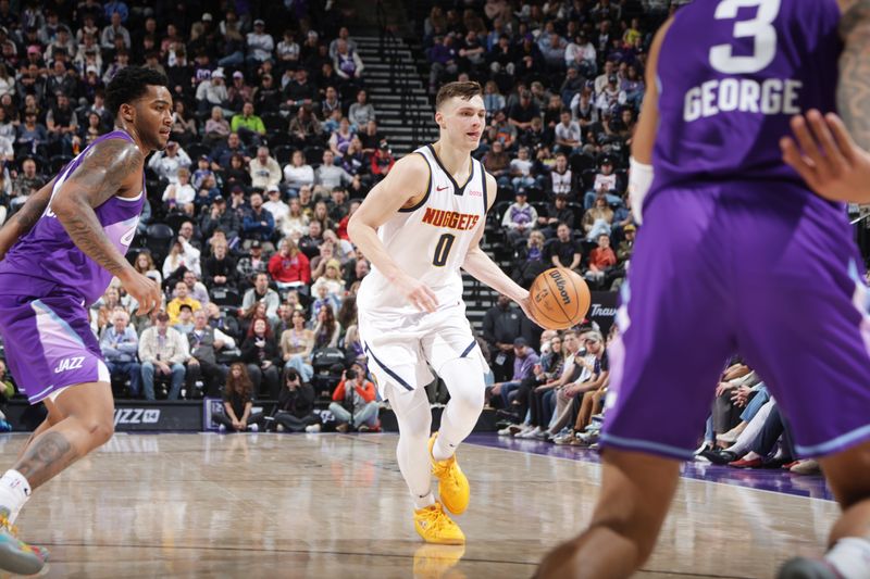 SALT LAKE CITY, UT - WEDNESDAY 27: Christian Braun #0 of the Denver Nuggets dribbles the ball during the game against the Utah Jazz on Wednesday 27, 2024 at vivint.SmartHome Arena in Salt Lake City, Utah. NOTE TO USER: User expressly acknowledges and agrees that, by downloading and or using this Photograph, User is consenting to the terms and conditions of the Getty Images License Agreement. Mandatory Copyright Notice: Copyright 2024 NBAE (Photo by Melissa Majchrzak/NBAE via Getty Images)