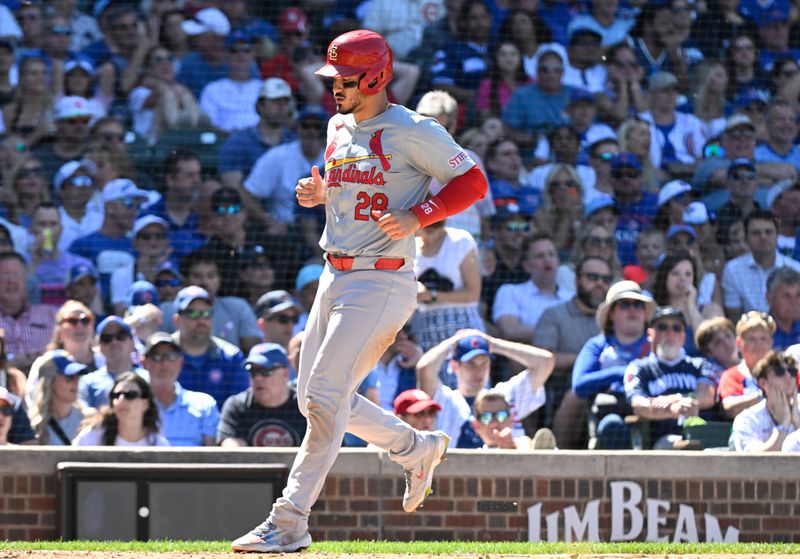 Jun 14, 2024; Chicago, Illinois, USA;  St. Louis Cardinals third base Nolan Arenado (28)  scores against the Chicago Cubs   during the ninth inning at Wrigley Field. Mandatory Credit: Matt Marton-USA TODAY Sports