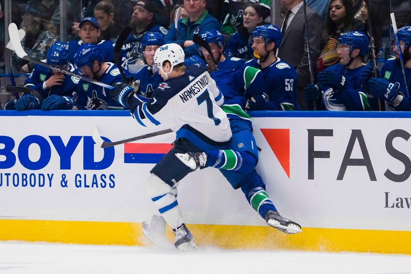 Feb 17, 2024; Vancouver, British Columbia, CAN; Winnipeg Jets forward Vladislav Namestnikov (7) checks Vancouver Canucks defenseman Quinn Hughes (43) in the first period at Rogers Arena. Mandatory Credit: Bob Frid-USA TODAY Sports