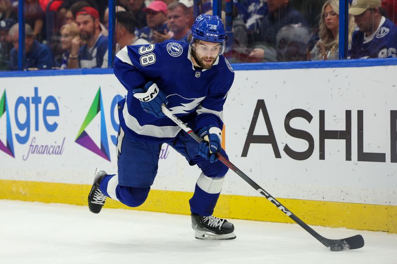 Feb 22, 2024; Tampa, Florida, USA;  Tampa Bay Lightning left wing Brandon Hagel (38) controls the puck against the Washington Capitals in the first period at Amalie Arena. Mandatory Credit: Nathan Ray Seebeck-USA TODAY Sports