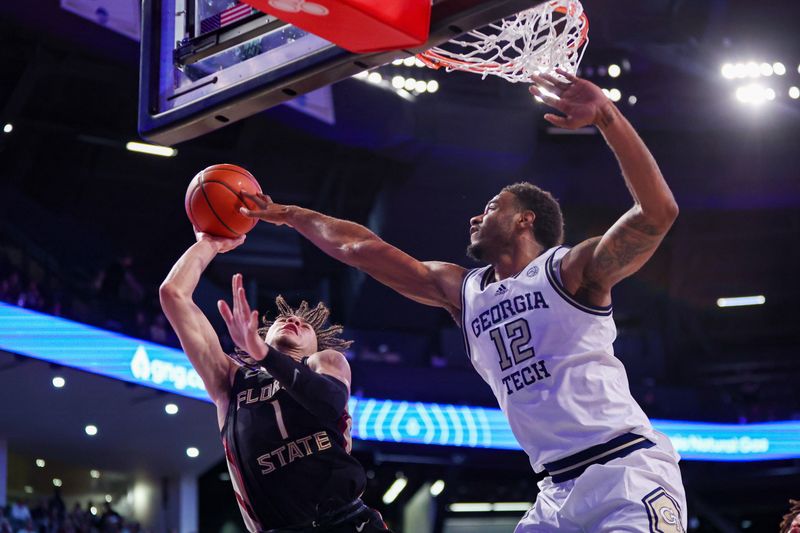 Mar 2, 2024; Atlanta, Georgia, USA; Florida State Seminoles guard Jalen Warley (1) shoots past Georgia Tech Yellow Jackets forward Tyzhaun Claude (12) in the first half at McCamish Pavilion. Mandatory Credit: Brett Davis-USA TODAY Sports