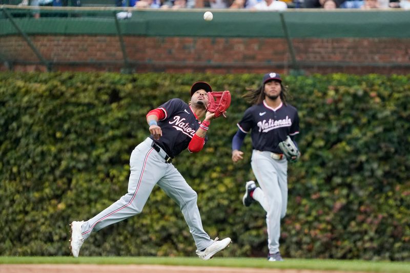 Sep 22, 2024; Chicago, Illinois, USA; Washington Nationals shortstop Nasim Nuñez (26) makes a catch on Chicago Cubs catcher Miguel Amaya (not pictured) during the second inning at Wrigley Field. Mandatory Credit: David Banks-Imagn Images