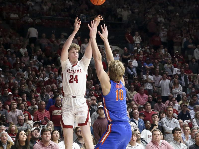 Feb 21, 2024; Tuscaloosa, Alabama, USA;  Alabama Crimson Tide forward Sam Walters (24) shoots a three point basket over Florida Gators forward Thomas Haugh (10) at Coleman Coliseum. Mandatory Credit: Gary Cosby Jr.-USA TODAY Sports