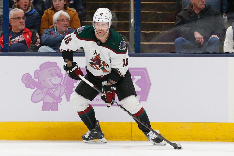 Nov 16, 2023; Columbus, Ohio, USA; Arizona Coyotes right wing Jason Zucker (16) passes the puck against the Columbus Blue Jackets during the first period at Nationwide Arena. Mandatory Credit: Russell LaBounty-USA TODAY Sports