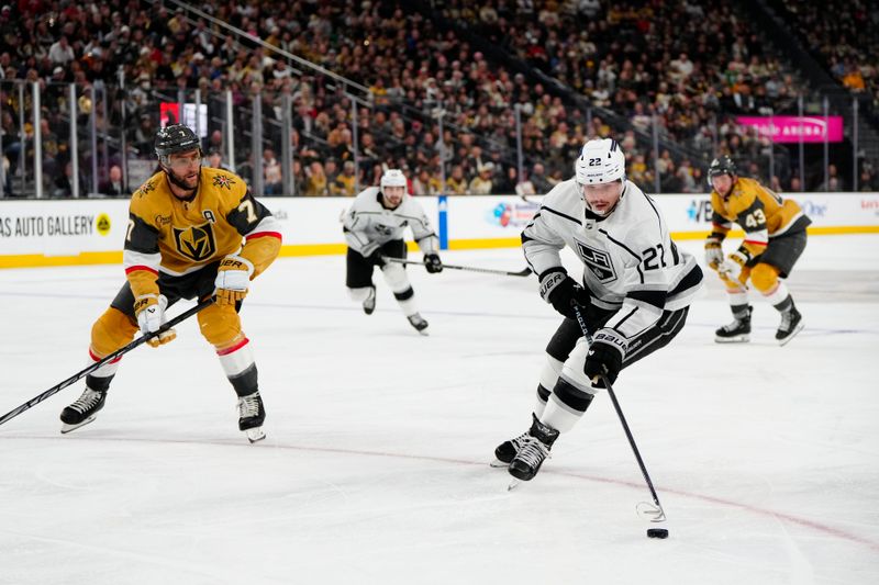 Dec 28, 2023; Las Vegas, Nevada, USA; Los Angeles Kings left wing Kevin Fiala (22) skates with the puck against Vegas Golden Knights defenseman Alex Pietrangelo (7) during the third period at T-Mobile Arena. Mandatory Credit: Lucas Peltier-USA TODAY Sports