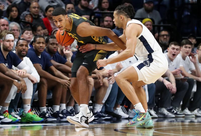 Jan 1, 2023; University Park, Pennsylvania, USA; Iowa Hawkeyes forward Kris Murray (24) holds onto the ball as Penn State Nittany Lions guard/forward Seth Lundy (1) defends during the first half at Bryce Jordan Center. Mandatory Credit: Matthew OHaren-USA TODAY Sports