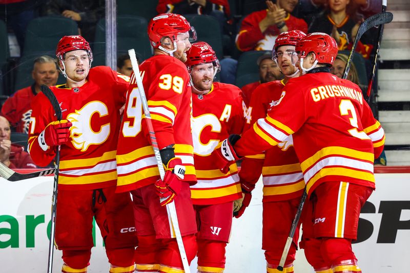 Sep 28, 2024; Calgary, Alberta, CAN; Calgary Flames center Blake Coleman (20) celebrates his goal with teammates against the Vancouver Canucks during the second period at Scotiabank Saddledome. Mandatory Credit: Sergei Belski-Imagn Images