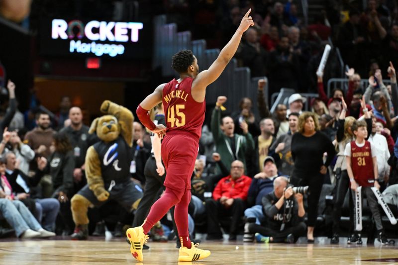 CLEVELAND, OHIO - APRIL 12: Donovan Mitchell #45 of the Cleveland Cavaliers celebrates a basket made by Isaac Okoro during the second half against the Indiana Pacers at Rocket Mortgage Fieldhouse on April 12, 2024 in Cleveland, Ohio. NOTE TO USER: User expressly acknowledges and agrees that, by downloading and or using this photograph, User is consenting to the terms and conditions of the Getty Images License Agreement. (Photo by Nick Cammett/Getty Images)