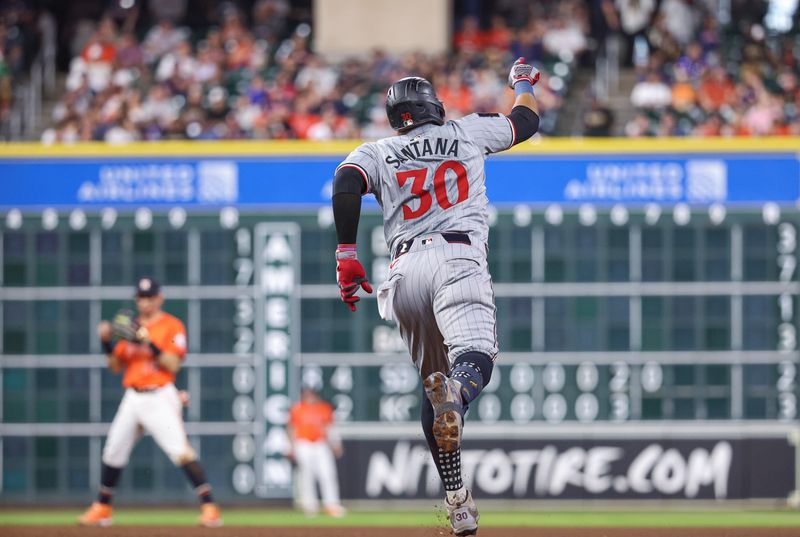 May 31, 2024; Houston, Texas, USA; Minnesota Twins first baseman Carlos Santana (30) rounds the bases after hitting a home run during the eighth inning against the Houston Astros at Minute Maid Park. Mandatory Credit: Troy Taormina-USA TODAY Sports