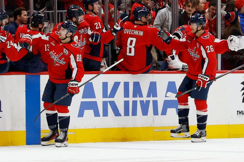 Jan 4, 2025; Washington, District of Columbia, USA; Washington Capitals left wing Andrew Mangiapane (88) celebrates with teammates after scoring a goal against the New York Rangers in the second period at Capital One Arena. Mandatory Credit: Geoff Burke-Imagn Images