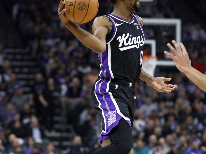 SACRAMENTO, CALIFORNIA - JANUARY 03: Malik Monk #0 of the Sacramento Kings looks to pass the ball against the Orlando Magic during the first half of an NBA basketball game at Golden 1 Center on January 03, 2024 in Sacramento, California. NOTE TO USER: User expressly acknowledges and agrees that, by downloading and or using this photograph, User is consenting to the terms and conditions of the Getty Images License Agreement. (Photo by Thearon W. Henderson/Getty Images)