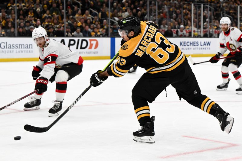 Nov 9, 2024; Boston, Massachusetts, USA; Boston Bruins left wing Brad Marchand (63) takes a shot against the Ottawa Senators during the first period at TD Garden. Mandatory Credit: Brian Fluharty-Imagn Images