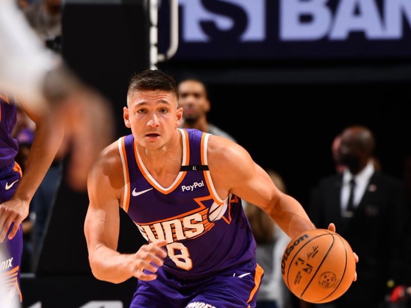 PHOENIX, AZ - NOVEMBER 27: Grayson Allen #8 of the Phoenix Suns dribbles the ball during the game against the Brooklyn Nets on November 27, 2024 at Footprint Center in Phoenix, Arizona. NOTE TO USER: User expressly acknowledges and agrees that, by downloading and or using this photograph, user is consenting to the terms and conditions of the Getty Images License Agreement. Mandatory Copyright Notice: Copyright 2024 NBAE (Photo by Barry Gossage/NBAE via Getty Images)