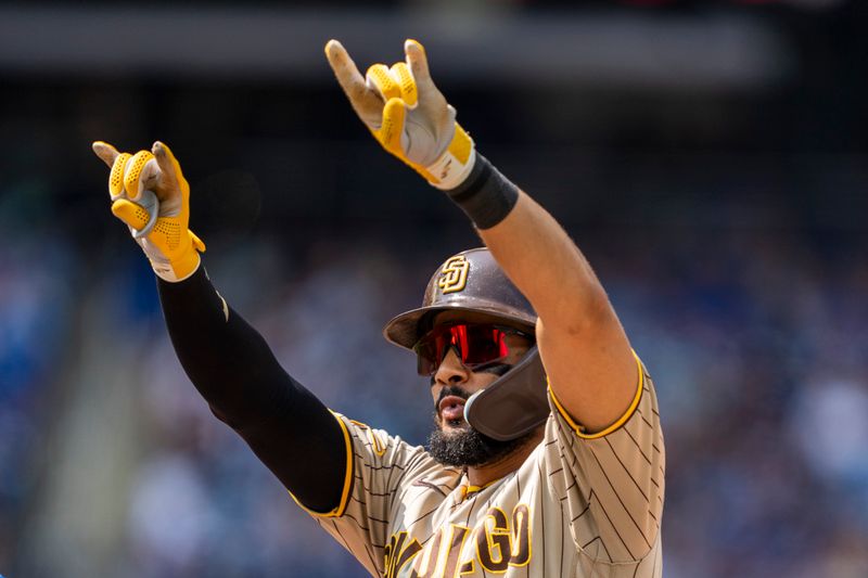 Jul 20, 2023; Toronto, Ontario, CAN; San Diego Padres right fielder Fernando Tatis Jr. (23) celebrates after hitting a single during the eighth inning against the Toronto Blue Jays at Rogers Centre. Mandatory Credit: Kevin Sousa-USA TODAY Sports