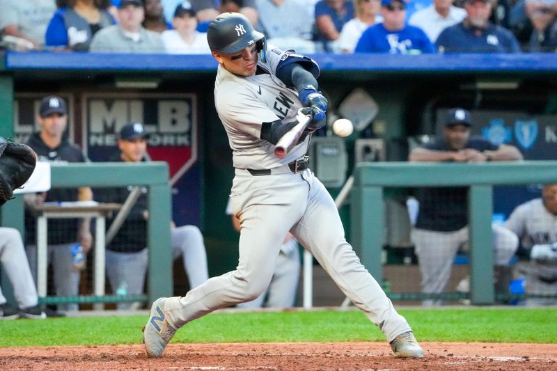 Jun 10, 2024; Kansas City, Missouri, USA; New York Yankees catcher Jose Trevino (39) hits a two-run single against the Kansas City Royals  in the fourth inning at Kauffman Stadium. Mandatory Credit: Denny Medley-USA TODAY Sports