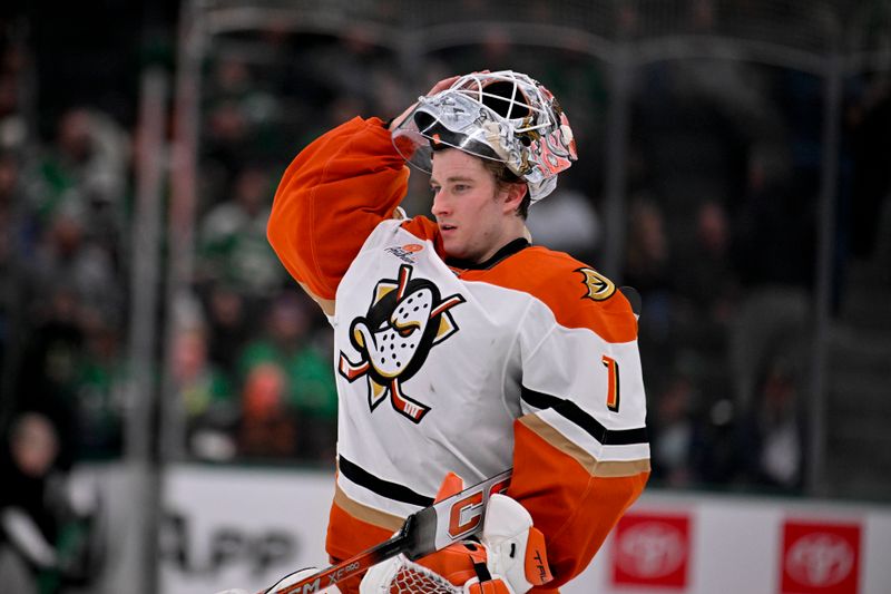 Mar 18, 2025; Dallas, Texas, USA; Anaheim Ducks goaltender Lukas Dostal (1) skates back on to the ice before the start of the overtime period at the American Airlines Center. Mandatory Credit: Jerome Miron-Imagn Images
