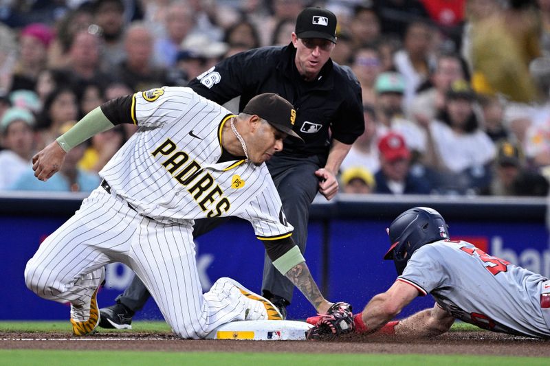 Jun 24, 2024; San Diego, California, USA; Washington Nationals center fielder Jacob Young (30) steals third base ahead of the tag by San Diego Padres third baseman Manny Machado (13) during the fifth inning at Petco Park. Mandatory Credit: Orlando Ramirez-USA TODAY Sports