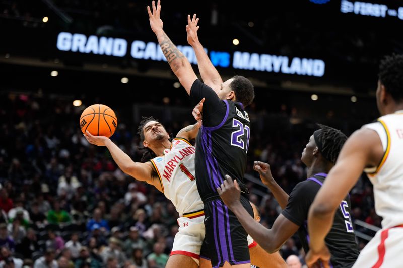 Mar 21, 2025; Seattle, WA, USA; Maryland Terrapins guard Rodney Rice (1) attempts to shoot while being defended by Grand Canyon Antelopes forward JaKobe Coles (21) during the second half at Climate Pledge Arena. Mandatory Credit: Stephen Brashear-Imagn Images