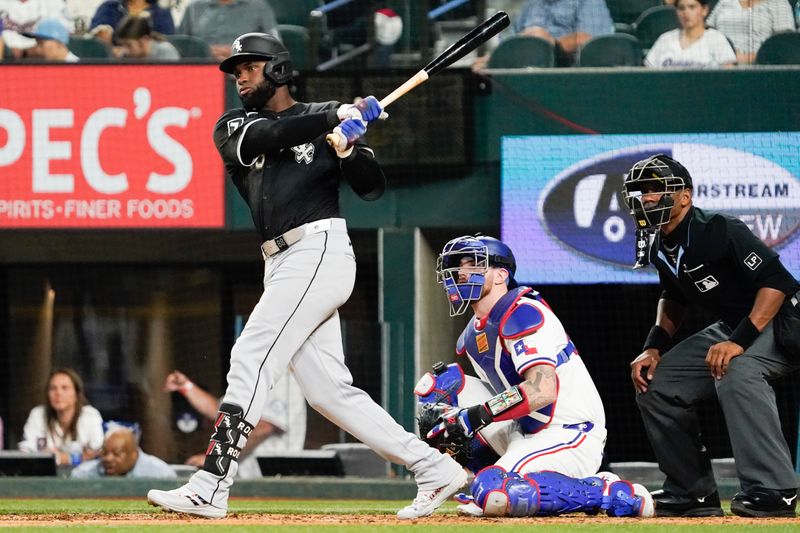 Jul 22, 2024; Arlington, Texas, USA; Chicago White Sox center fielder Luis Robert Jr. (88) singles during the fifth inning against the Texas Rangers at Globe Life Field. Mandatory Credit: Raymond Carlin III-USA TODAY Sports